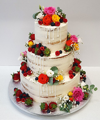 Hochzeitstorte mit bunden Blumen